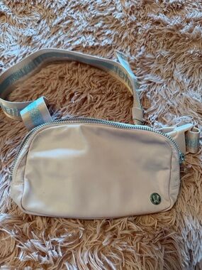 lululemon athletica Cream Crossbody Belt Bag with Striped Strap